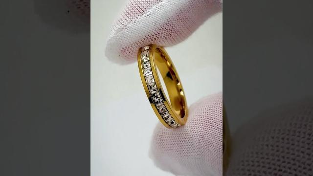 She wanted classy…does it deliver? 18k gold wedding ring with channel set princess cuts She wanted classy…does it deliver? 18k gold wedding ring with channel set princess cuts 