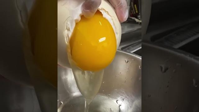 Cracking open an ostrich egg | food network | #shorts Cracking open an ostrich egg | food network | #shorts