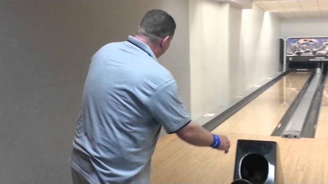 Ian bacon trying to bowl and stay balanced Ian bacon trying to bowl and stay balanced