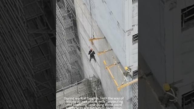 The crane operator rescued the worker suspended high in the air The crane operator rescued the worker suspended high in the air