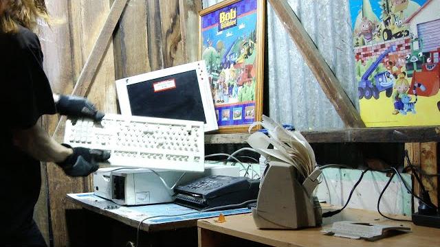 Angry office man destroys vintage computer Angry office man destroys vintage computer