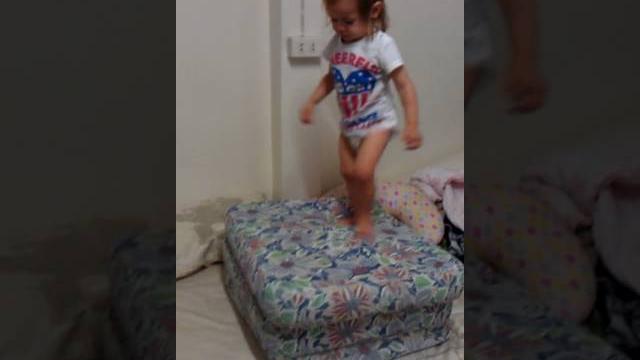 Funny kid jumping on pillow Funny kid jumping on pillow
