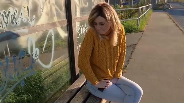 Girl has a pee desperation on bus stop Girl has a pee desperation on bus stop