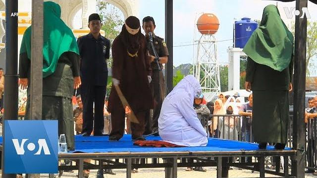 Unmarried couple caned in indonesia Unmarried couple caned in indonesia