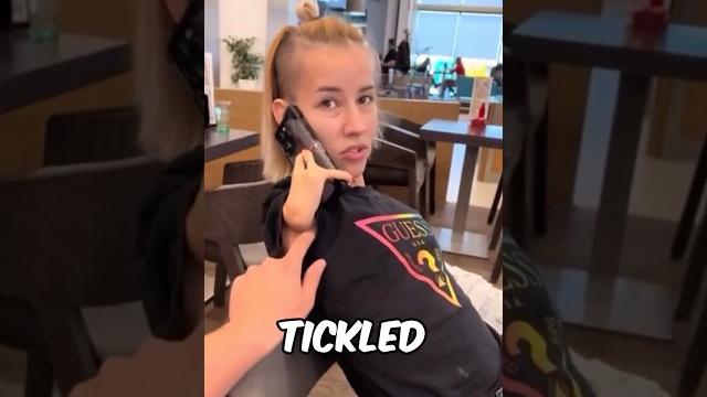 Her husband tickled her while she was on the phone Her husband tickled her while she was on the phone