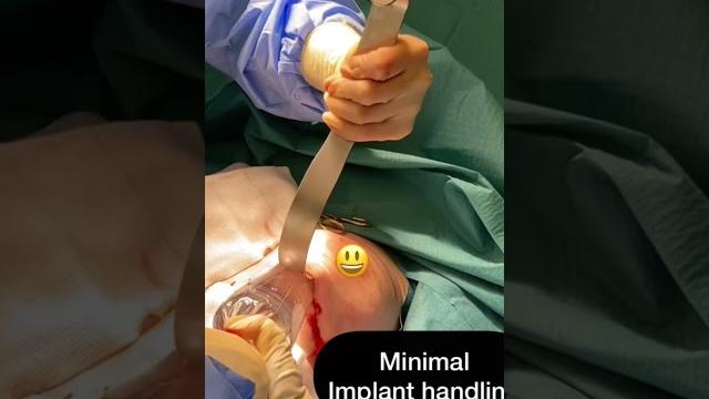 Breast implant insertion! warning surgical image Breast implant insertion! warning surgical image