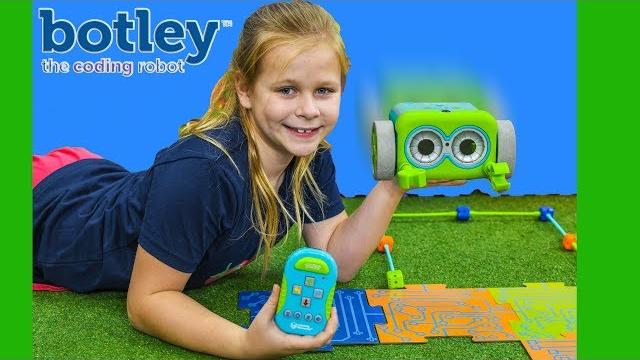 Assistant cracks the code with botley the coding robot Assistant cracks the code with botley the coding robot