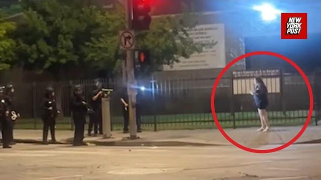 Video shows cop shooting woman at point-blank range with rubber bullet as she was trying to get home Video shows cop shooting woman at point-blank range with rubber bullet as she was trying to get home