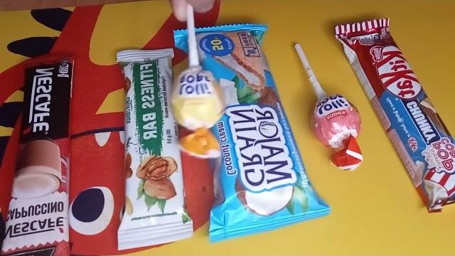 Some lot's of candies: chocolate, vs milka chocolate vs mallows vs fitness bar vs biscuit Some lot's of candies: chocolate, vs milka chocolate vs mallows vs fitness bar vs biscuit