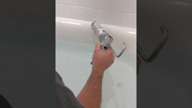 Caulking a tub #shorts #diy #youtubeshorts Caulking a tub #shorts #diy #youtubeshorts