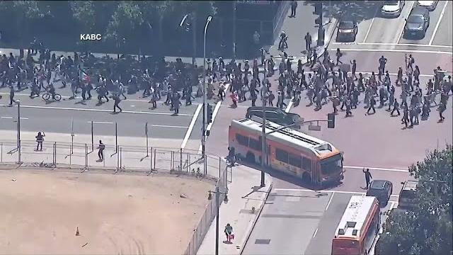 Los angeles protesters march through downtown streets in ice protest Los angeles protesters march through downtown streets in ice protest