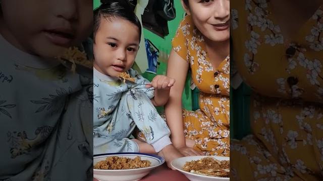 Young mother eating with very cute child Young mother eating with very cute child