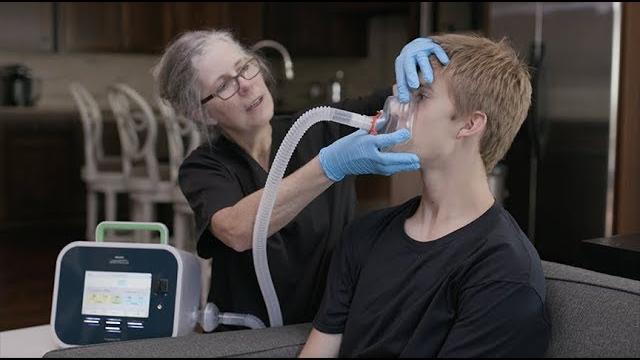 Giving a cough assist treatment Giving a cough assist treatment