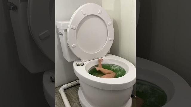Falling into the worlds largest toilet green swimming pool #shorts Falling into the worlds largest toilet green swimming pool #shorts