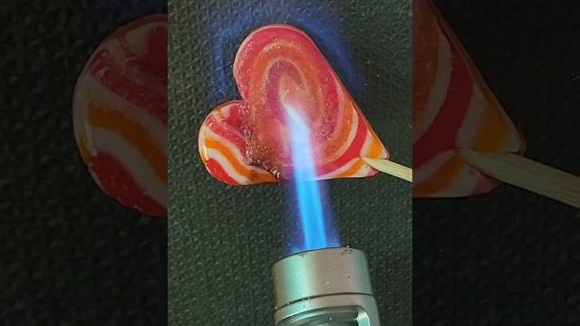Lollipop vs lighters - which one melts it faster? #shorts #satisfying #burntest #experiments Lollipop vs lighters - which one melts it faster? #shorts #satisfying #burntest #experiments