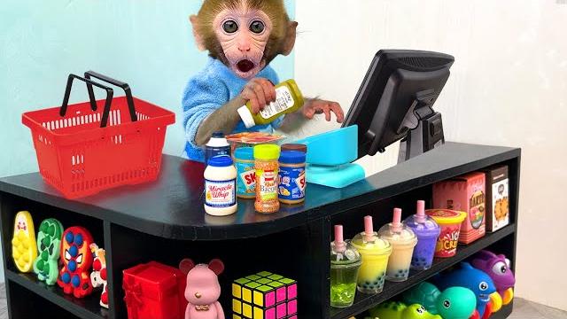 Monkey baby bon bon pretend to be a cashier in a supermarket and eats watermelon with puppy Monkey baby bon bon pretend to be a cashier in a supermarket and eats watermelon with puppy