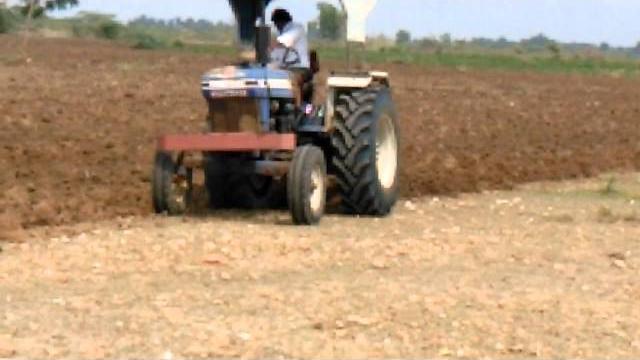 Powerful farmtrac 70 tractor in ploughing Powerful farmtrac 70 tractor in ploughing