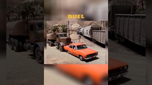 Semi truck tries to push a car into a moving train duel Semi truck tries to push a car into a moving train duel